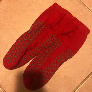 Red socks with grippers on the bottom